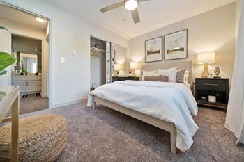 a bedroom with a bed and a ceiling fan at Bay Village, Vallejo, California